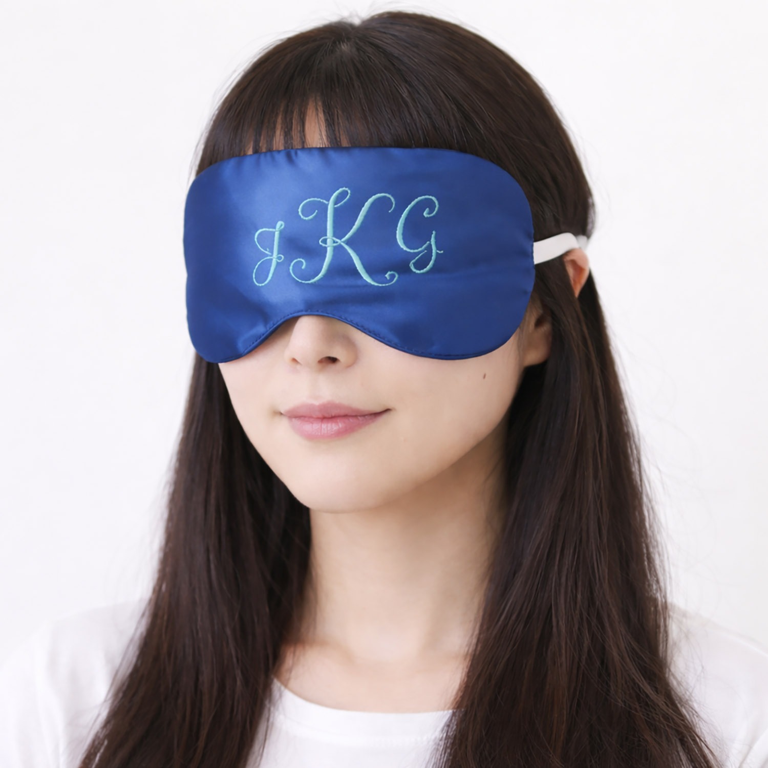 Women wears custom monogram sleeping mask
