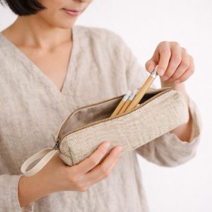 Women using our natural color hemp pencil case with YKK zipper closure