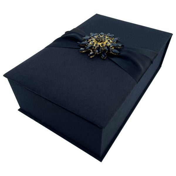 Black silk box with brooch