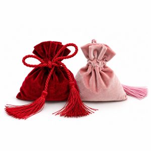 Red and blush pink velvet drawstring bags with decorative tassels