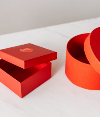 Square and round shaped lift lid orange paper box