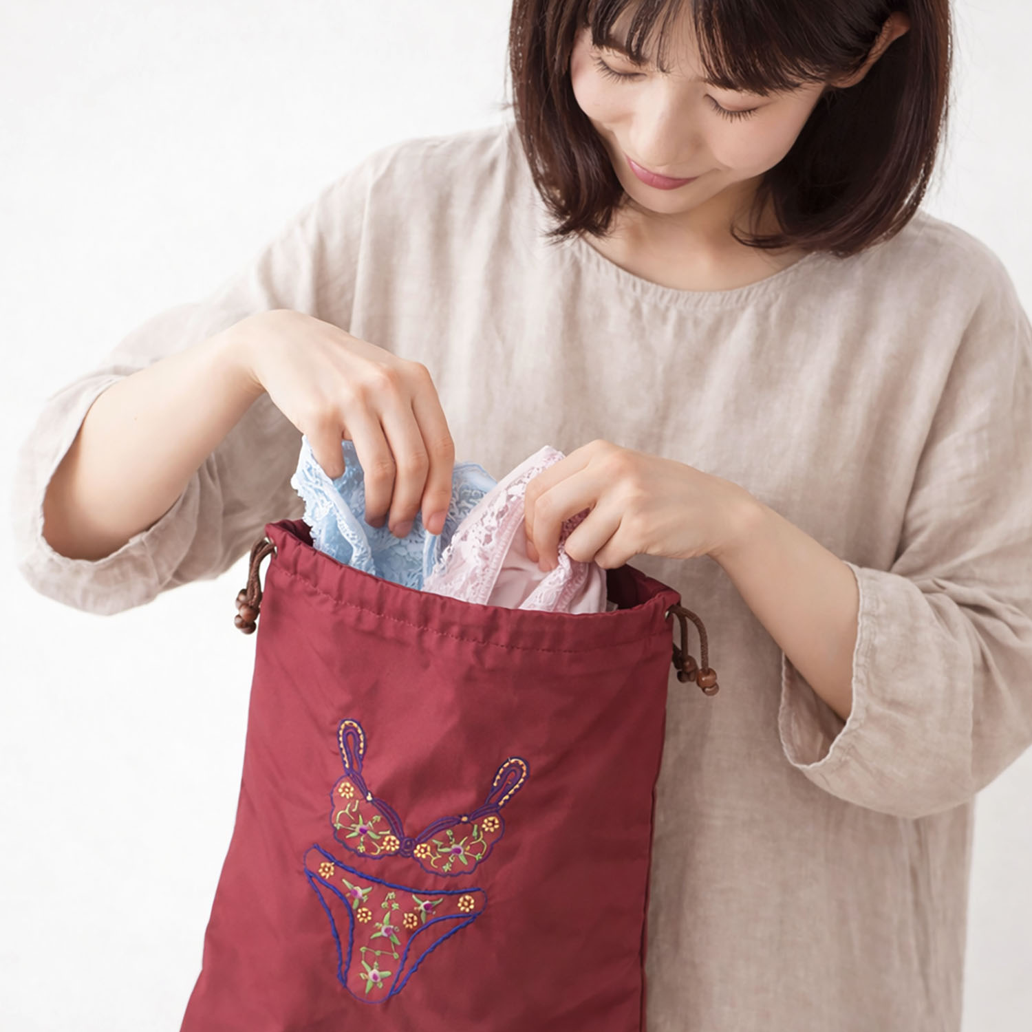 Custom embroidered silk lingerie bag from Thailand