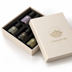 Custom essential oil packaging box with printed logo and protective laser-cut foam insert for glass bottles.