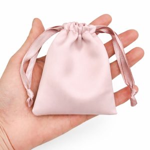 Blush pink satin drawstring bag from Thailand