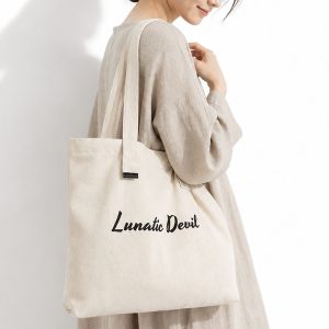 Women wearing our custom printed canvas cosmetic bag, made in Chiang Mai, Thailand.