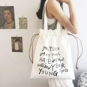 White cotton drawstring shopping bag with black text print