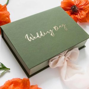 Custom foil stamped cardboard paper box in green with frayed ribbon