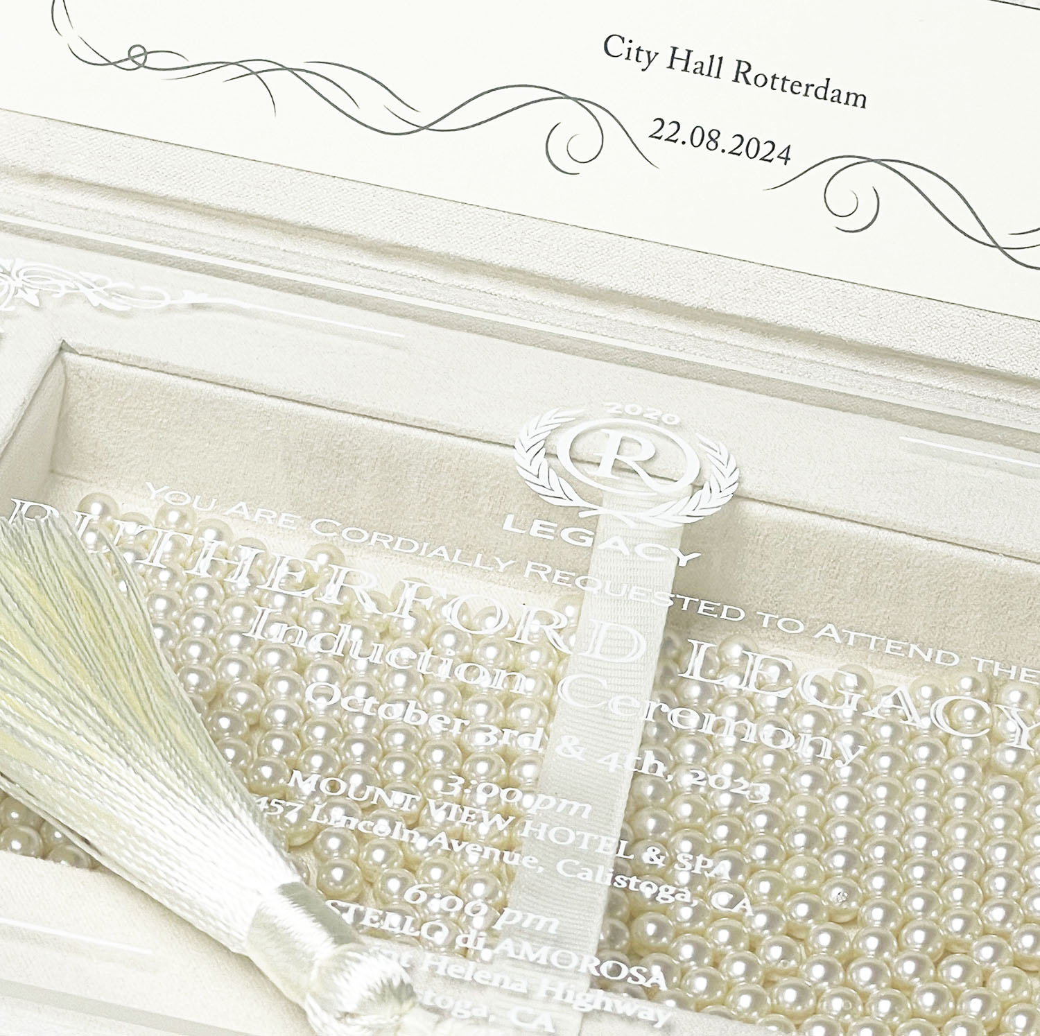 Close up of our ivory velvet invitation box with acrylic invitation card