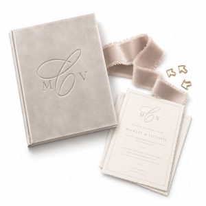 Custom monogram velvet invitation folio with debossed logo